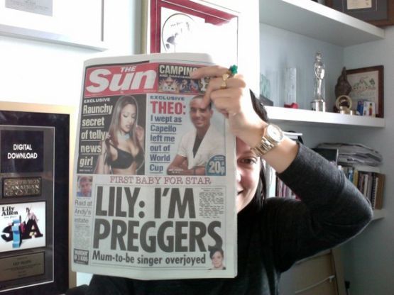 Lily Allen holds up copy of The Sun reporting she's pregnant