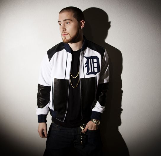 Mike Posner wearing a Detroit Tigers jacket