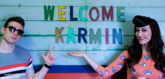 Walmart Risers featuring Amy Heidemann and Nick Noonan of Karmin and their band's sign